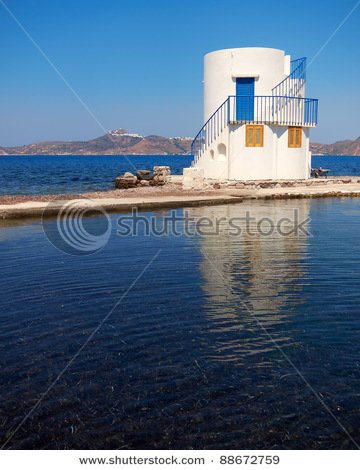 stock-photo-small-lighthouse-by-the-sea-space-for-typing-88672759.jpg
