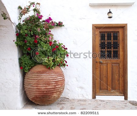 stock-photo-house-door-and-huge-flower-jar-greece-82209511.jpg