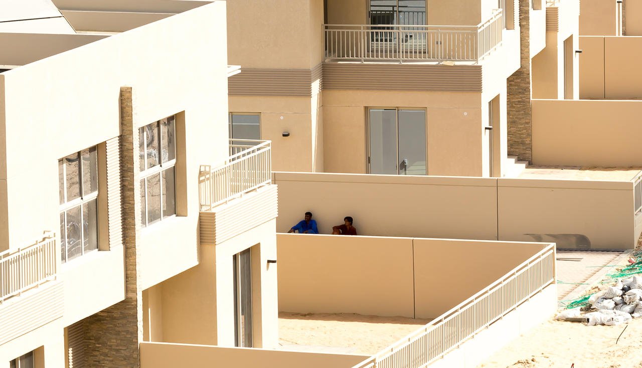 Dubai Labors hiding from the sun.jpg
